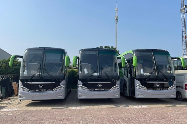 White and green B.T.L.L. Higer buses parked side by side