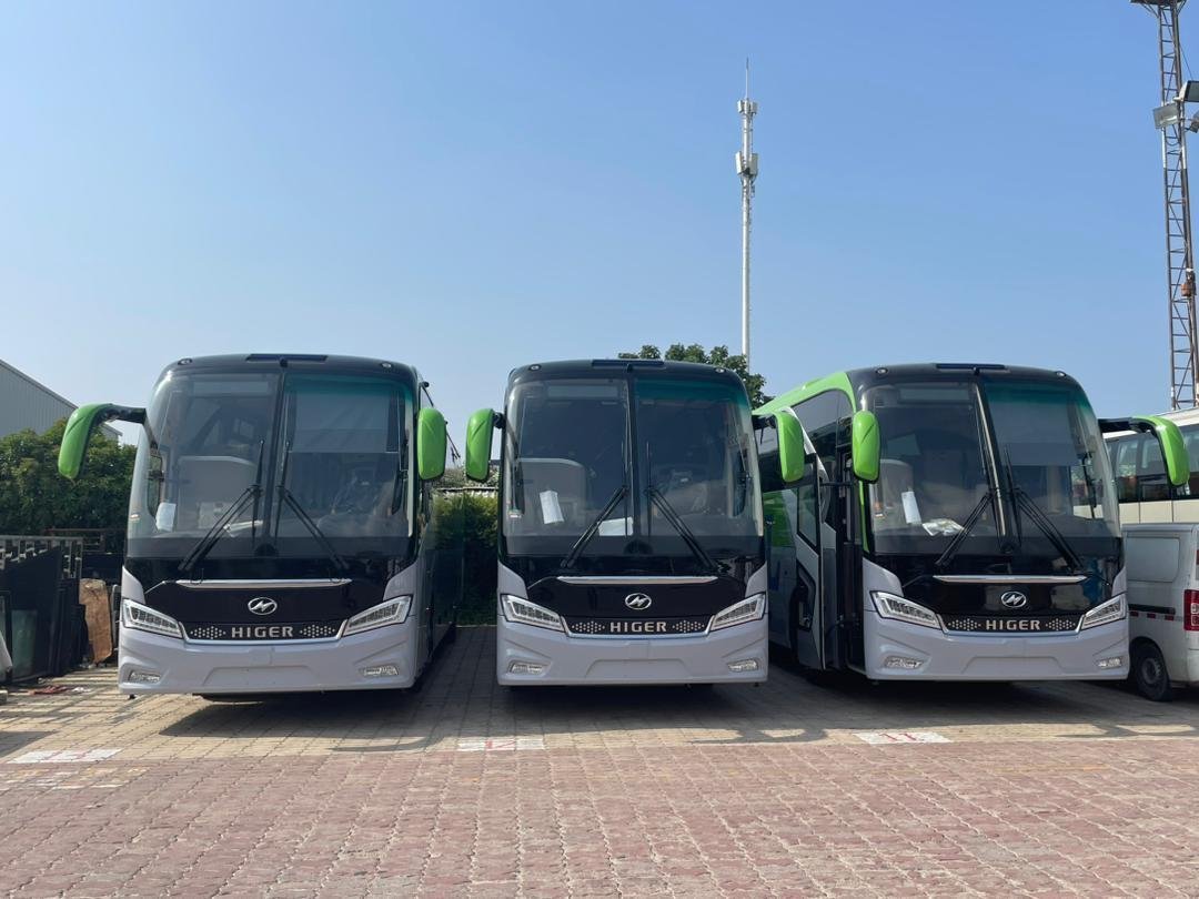 Three white and green B.T.L.L. Higer buses parked side by side